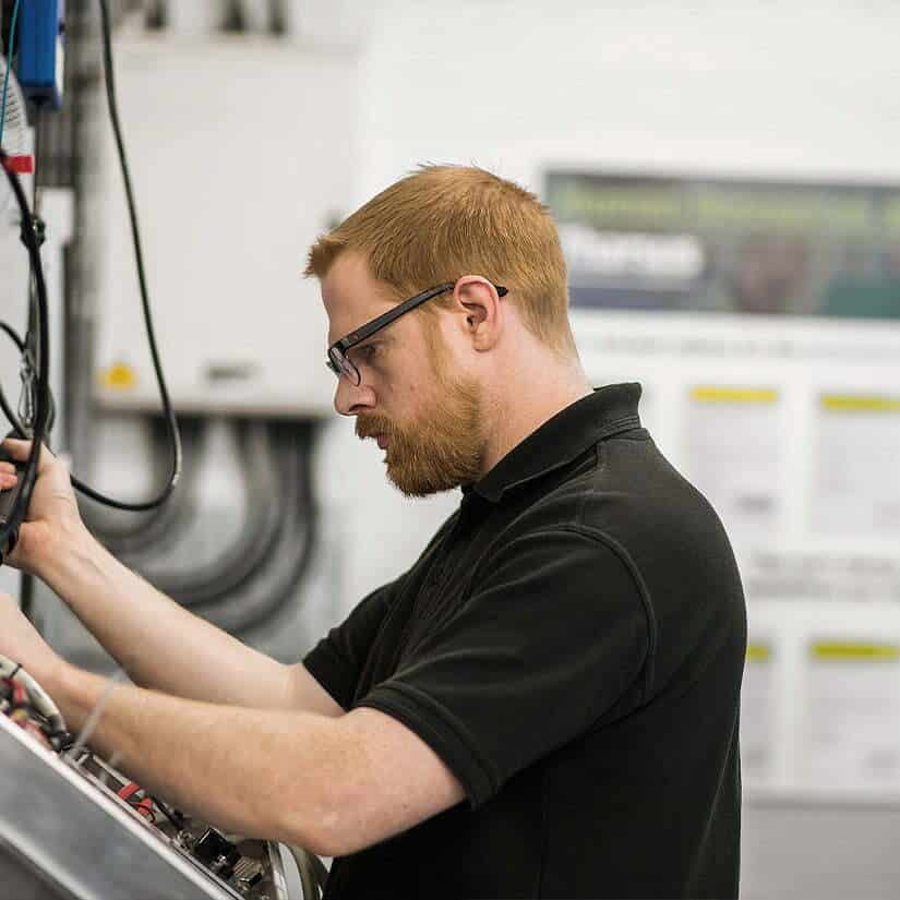 Man working on Ocado Smart Robot