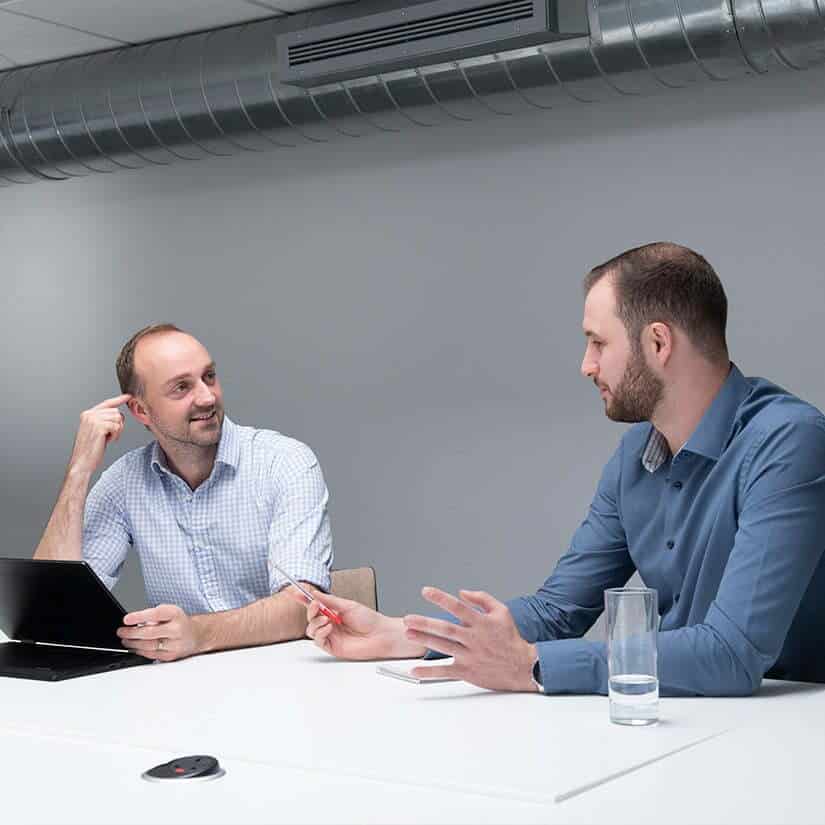 People meeting to discuss the design of an automated solution 