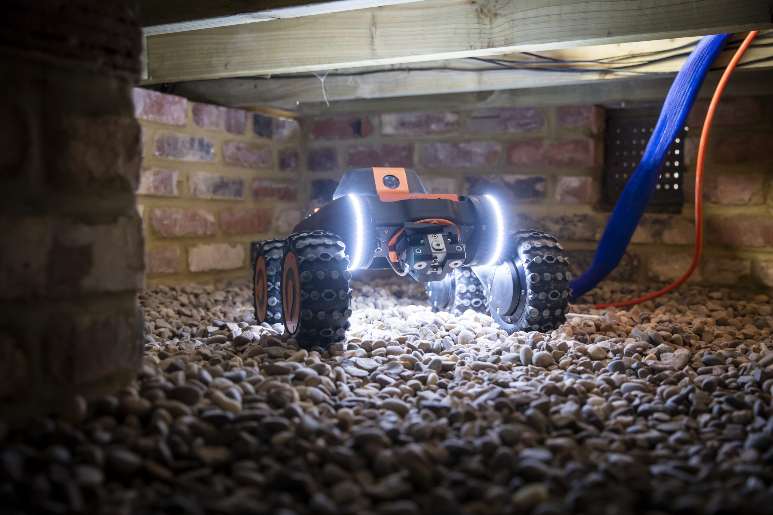 Q-Bot robot operating under the floor area of a home