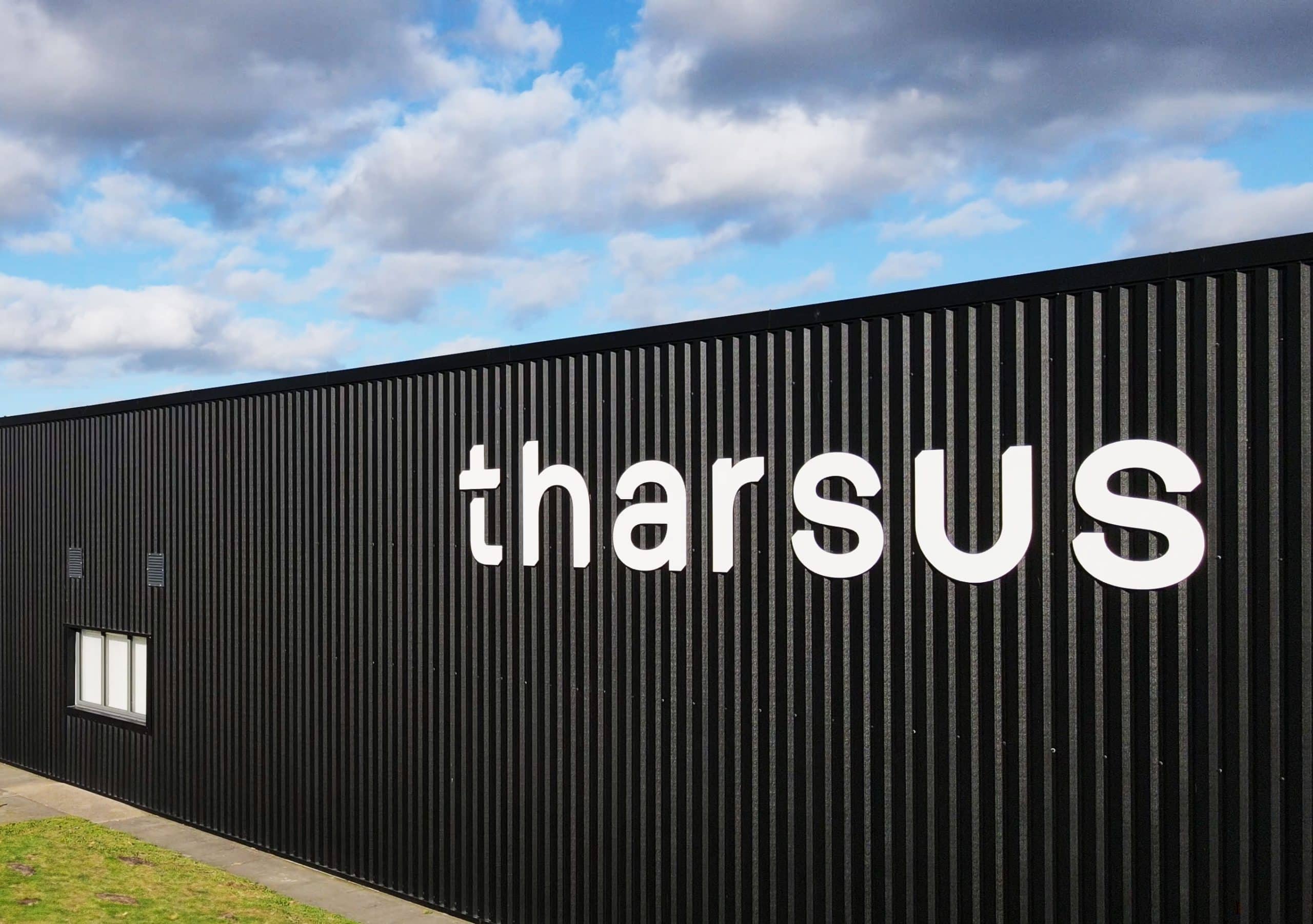 Close up of Tharsus logo on exterior wall of our building