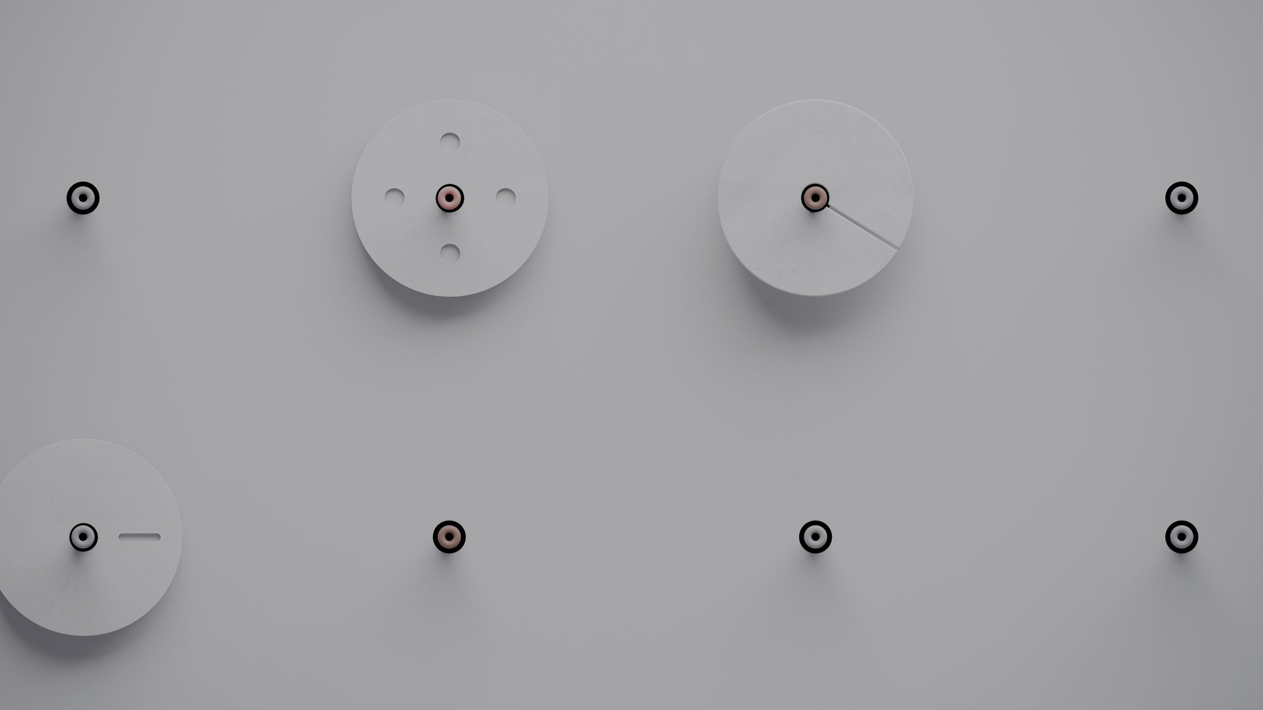 Multiple circular components on a grey background, symbolising precision engineering and opportunities at Tharsus.