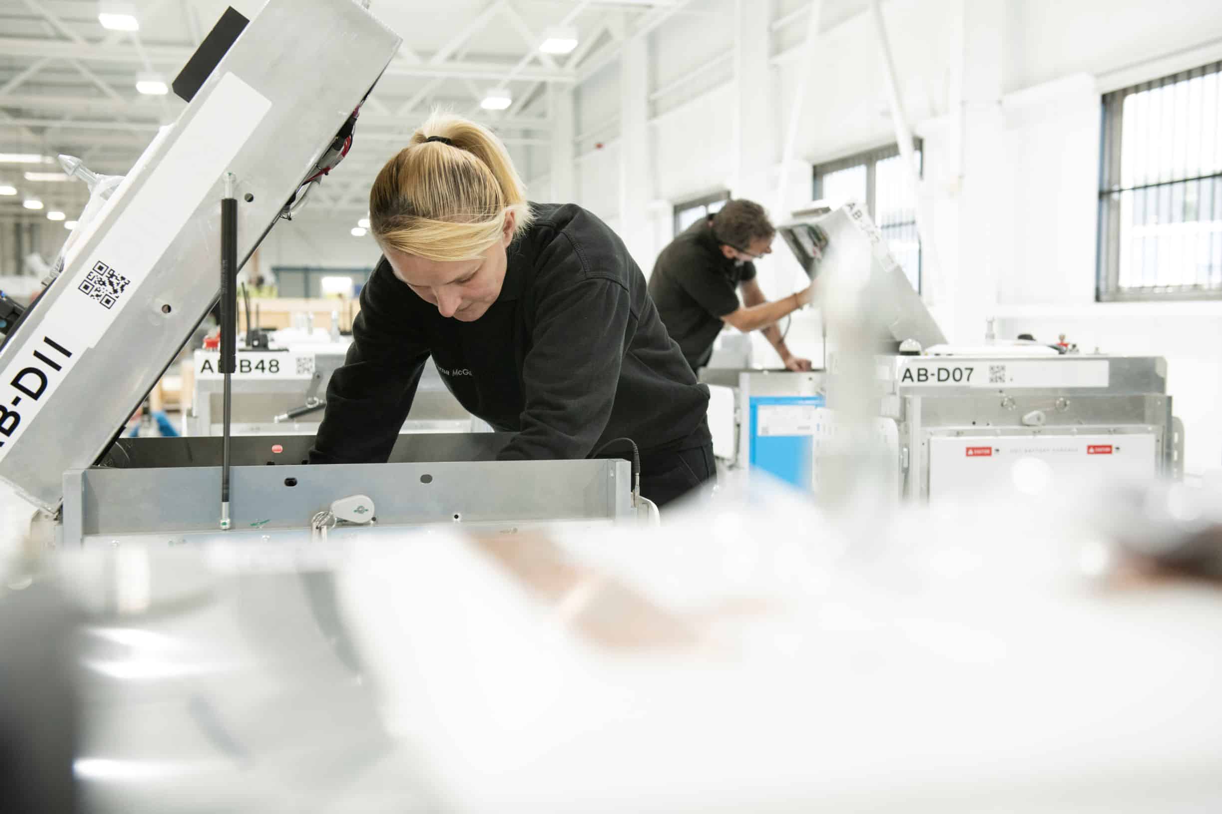 (Ocado 2) Tharsus production team assembling robots as part of advanced manufacturing operations.