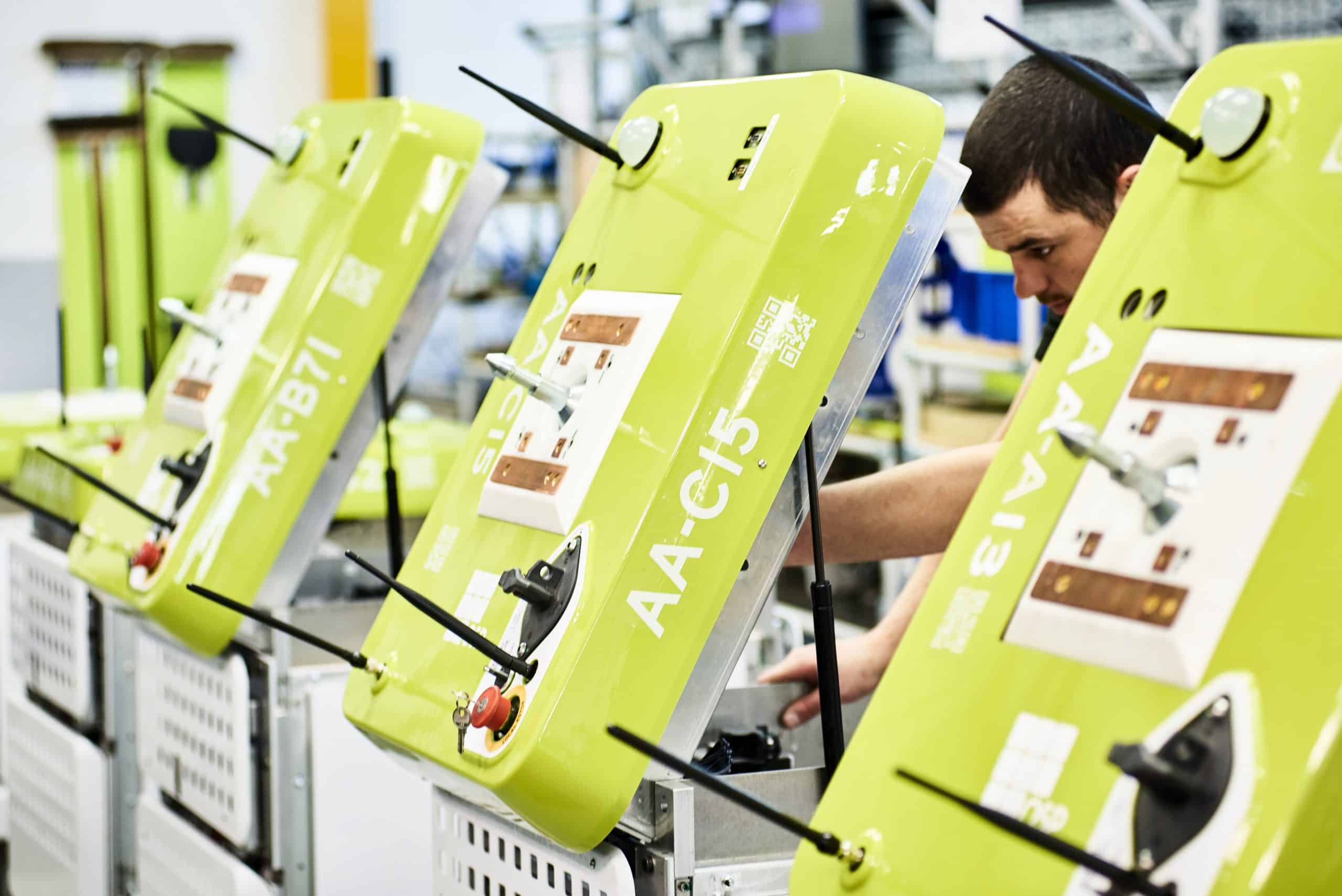 Tharsus engineer assembling autonomous robots during production at the UK manufacturing facility.